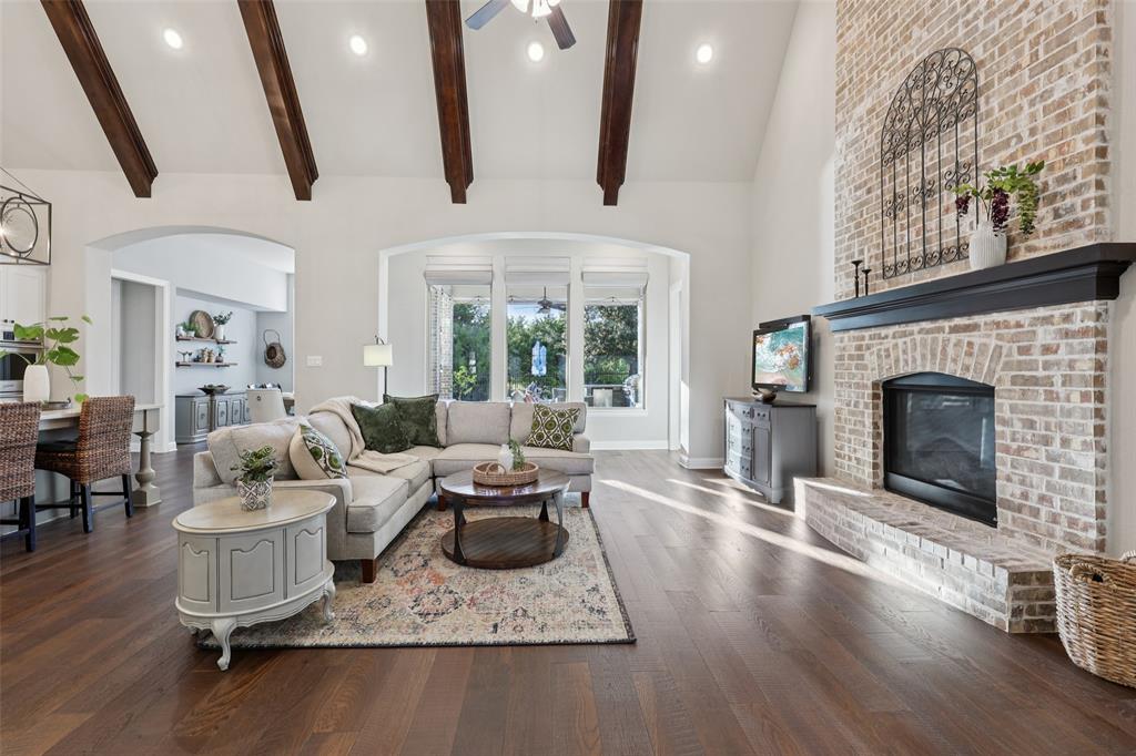 451 Morgan Lane Prosper, TX 75078 - Photo 6 of 38 a living room with furniture and a fireplace