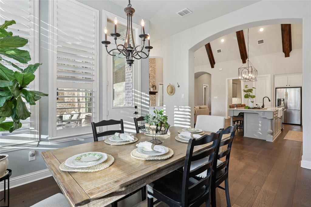 451 Morgan Lane Prosper, TX 75078 - Photo 10 of 38 a view of a dining room with furniture and wooden floor