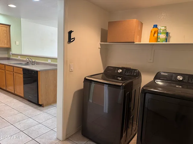 a kitchen with a refrigerator and cabinets