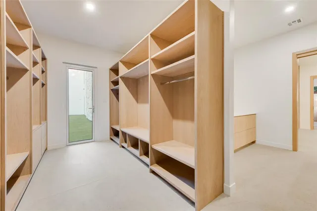 a view of a hallway with closet