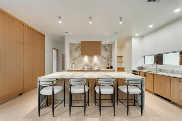 a kitchen with a table and chairs in it