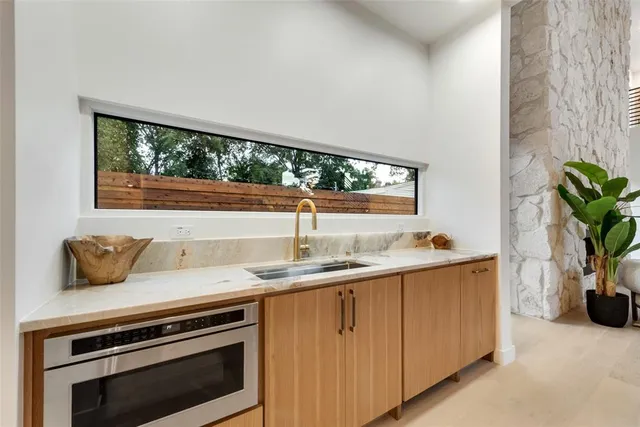 a kitchen with a sink and a stove