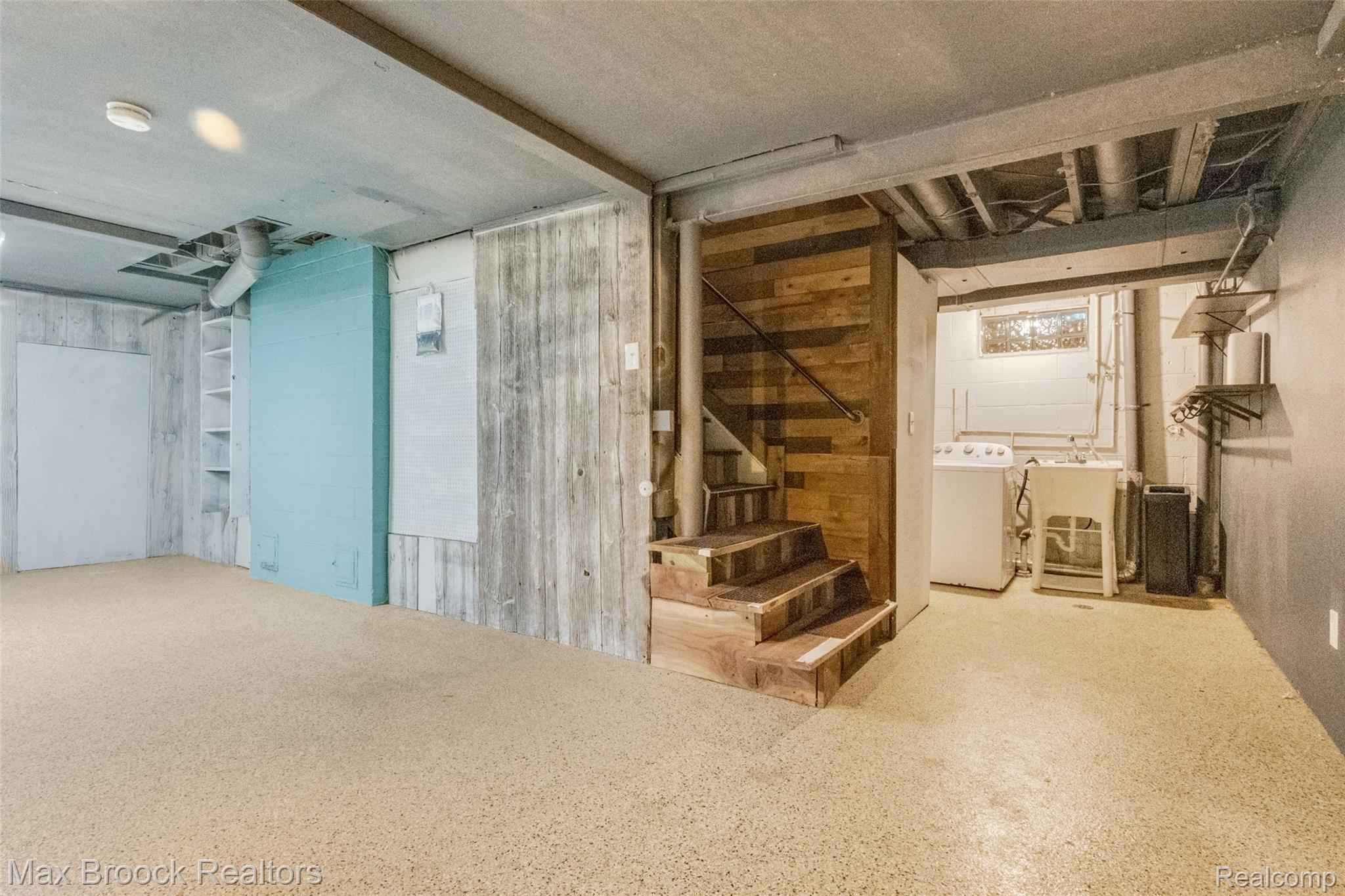 2905 Lahser Road Bloomfield Hills, MI 48304 - Photo 27 of 28 Lower level space featuring exposed ceiling joists and concrete flooring