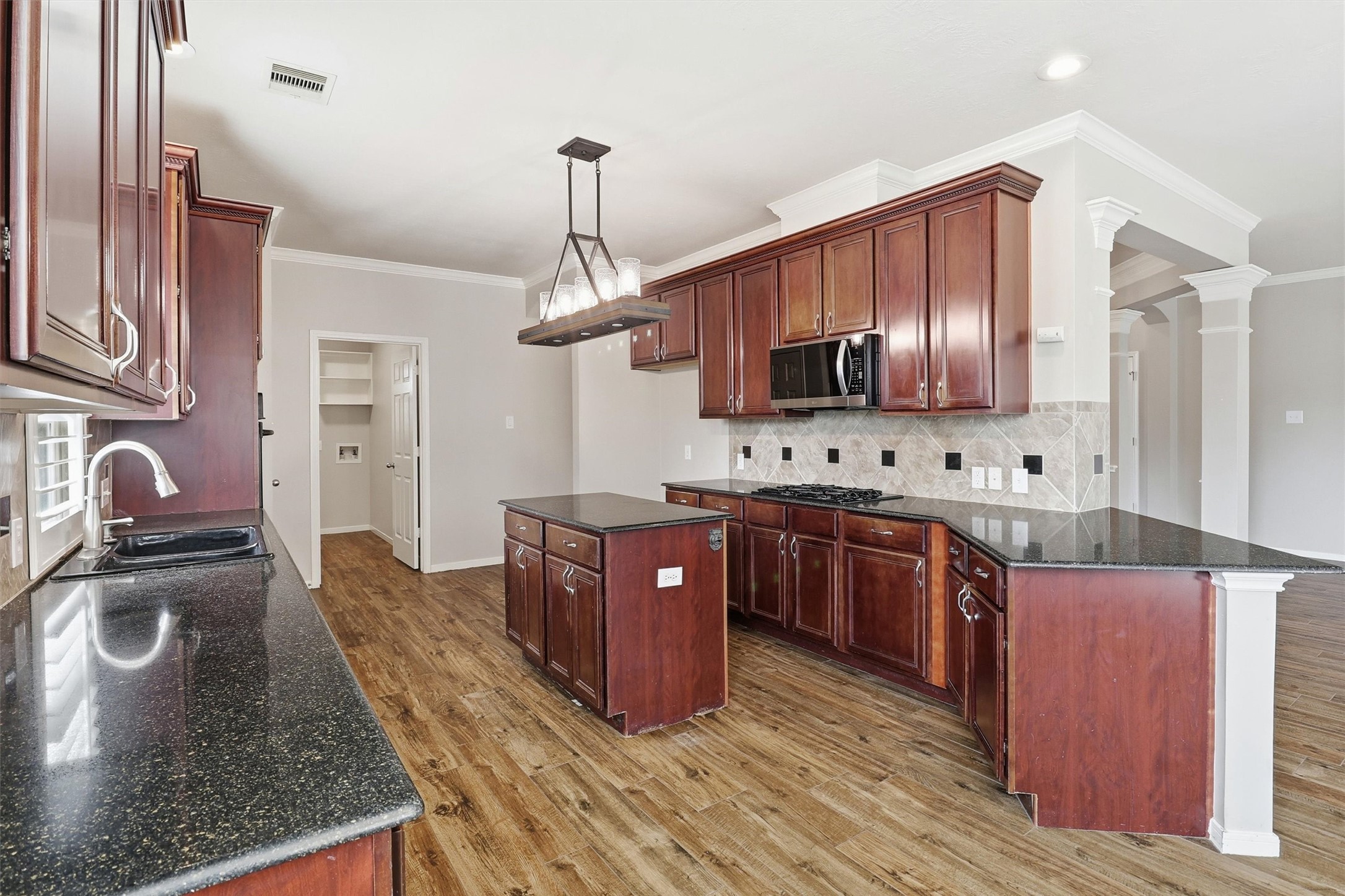 3602 River Bend Drive Rosenberg, TX 77471 - Photo 24 of 49 a kitchen with stainless steel appliances granite countertop a sink refrigerator stove and microwave