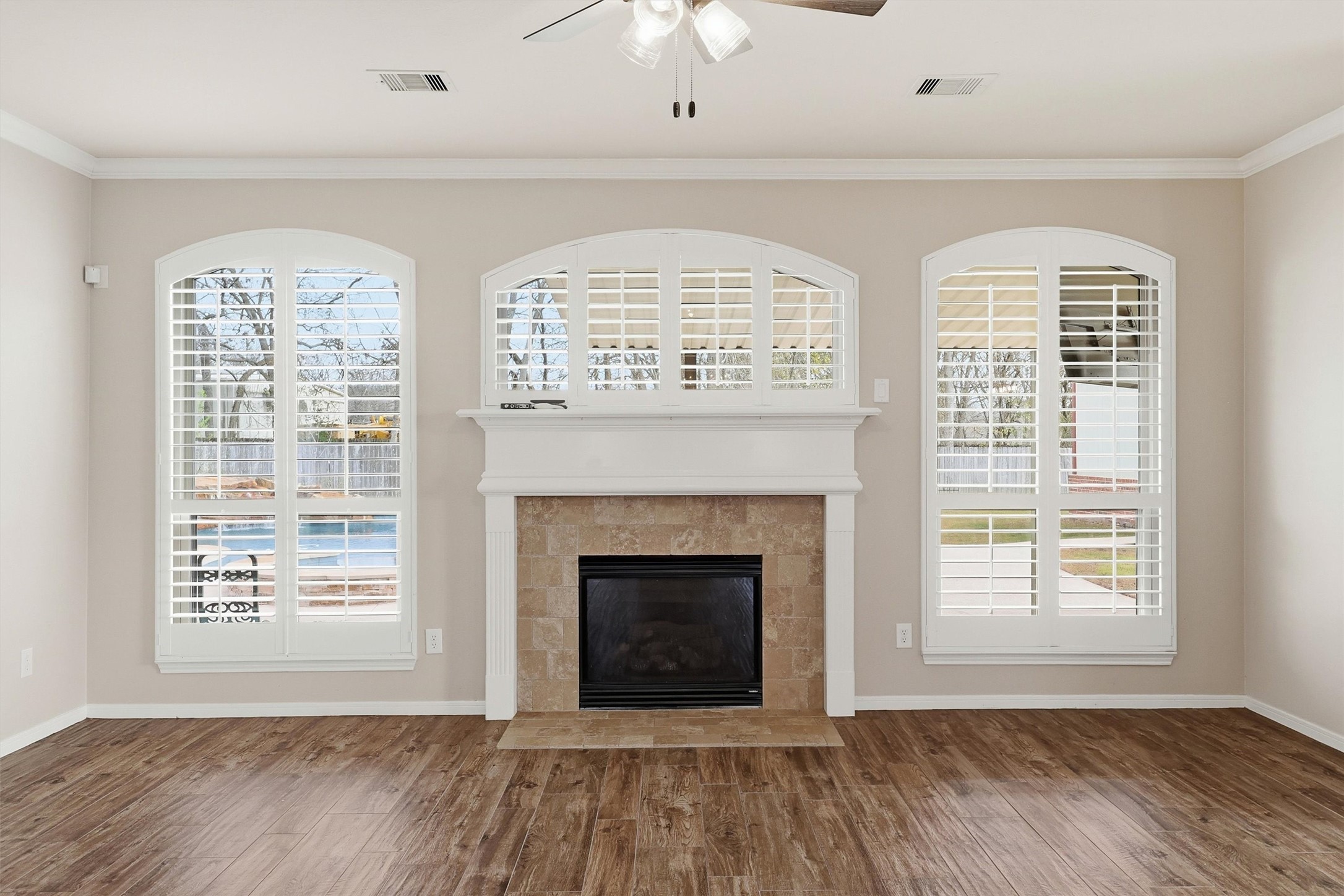 3602 River Bend Drive Rosenberg, TX 77471 - Photo 28 of 49 a view of an empty room with a fireplace and a window