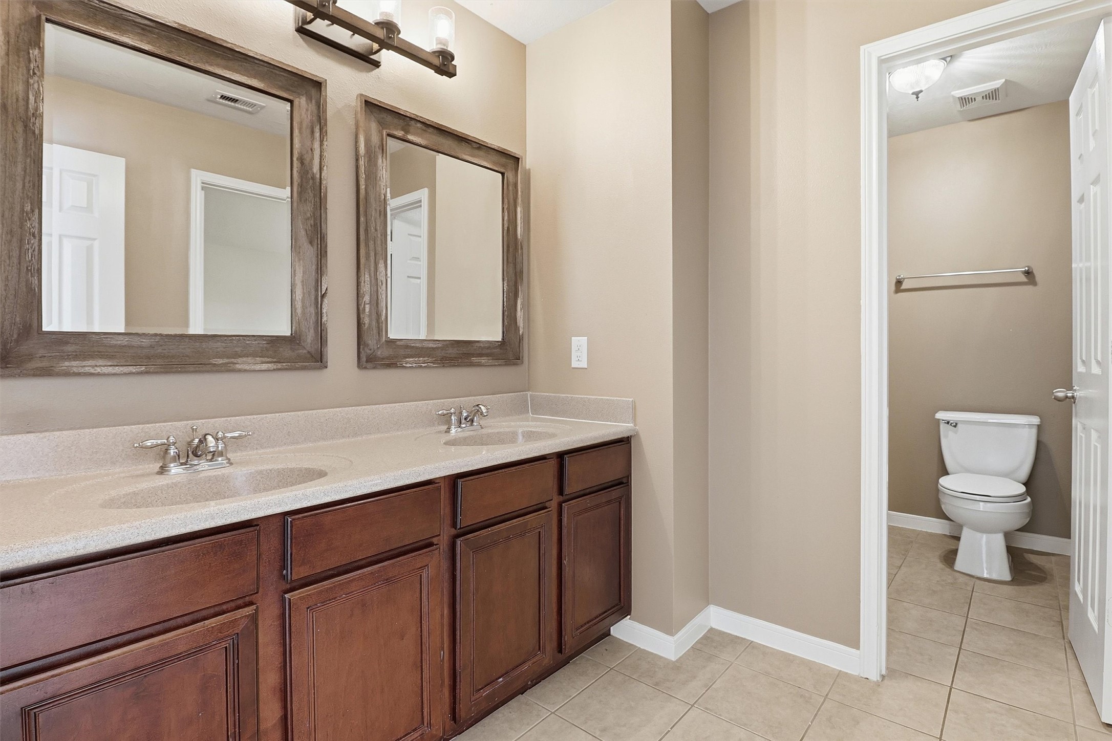 3602 River Bend Drive Rosenberg, TX 77471 - Photo 39 of 49 a bathroom with a toilet sink and mirror