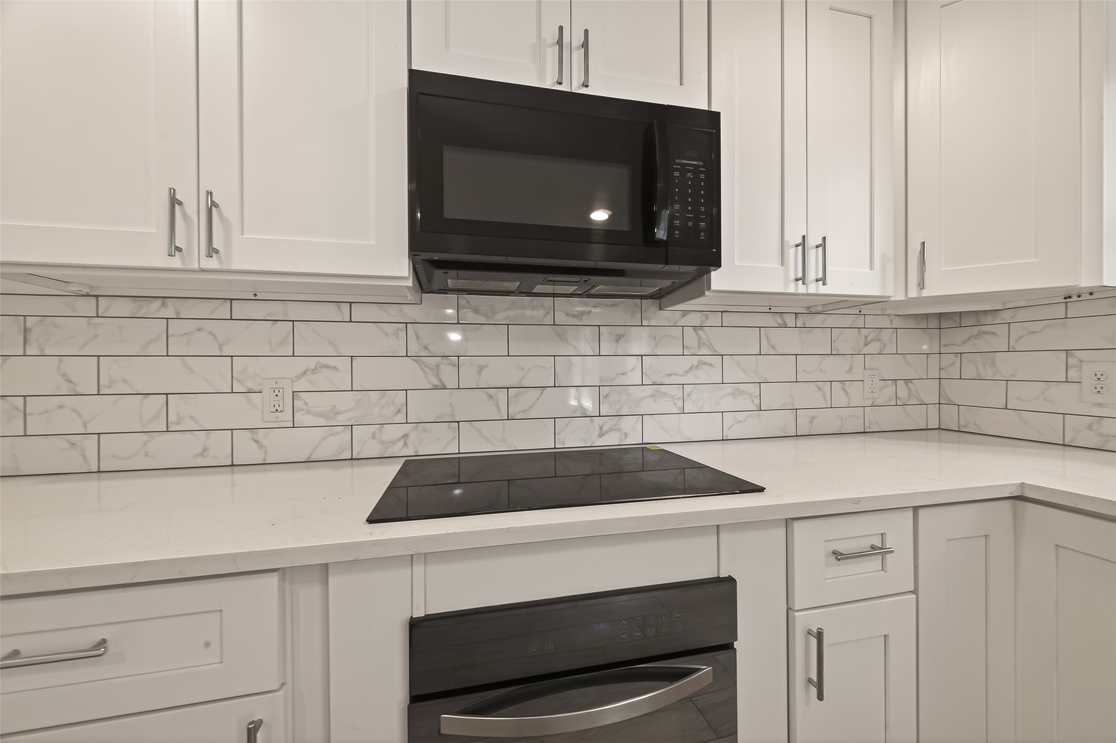 3710 Daphne Street Houston, TX 77021 - Photo 12 of 39 a kitchen with microwave cabinets and a stove top oven