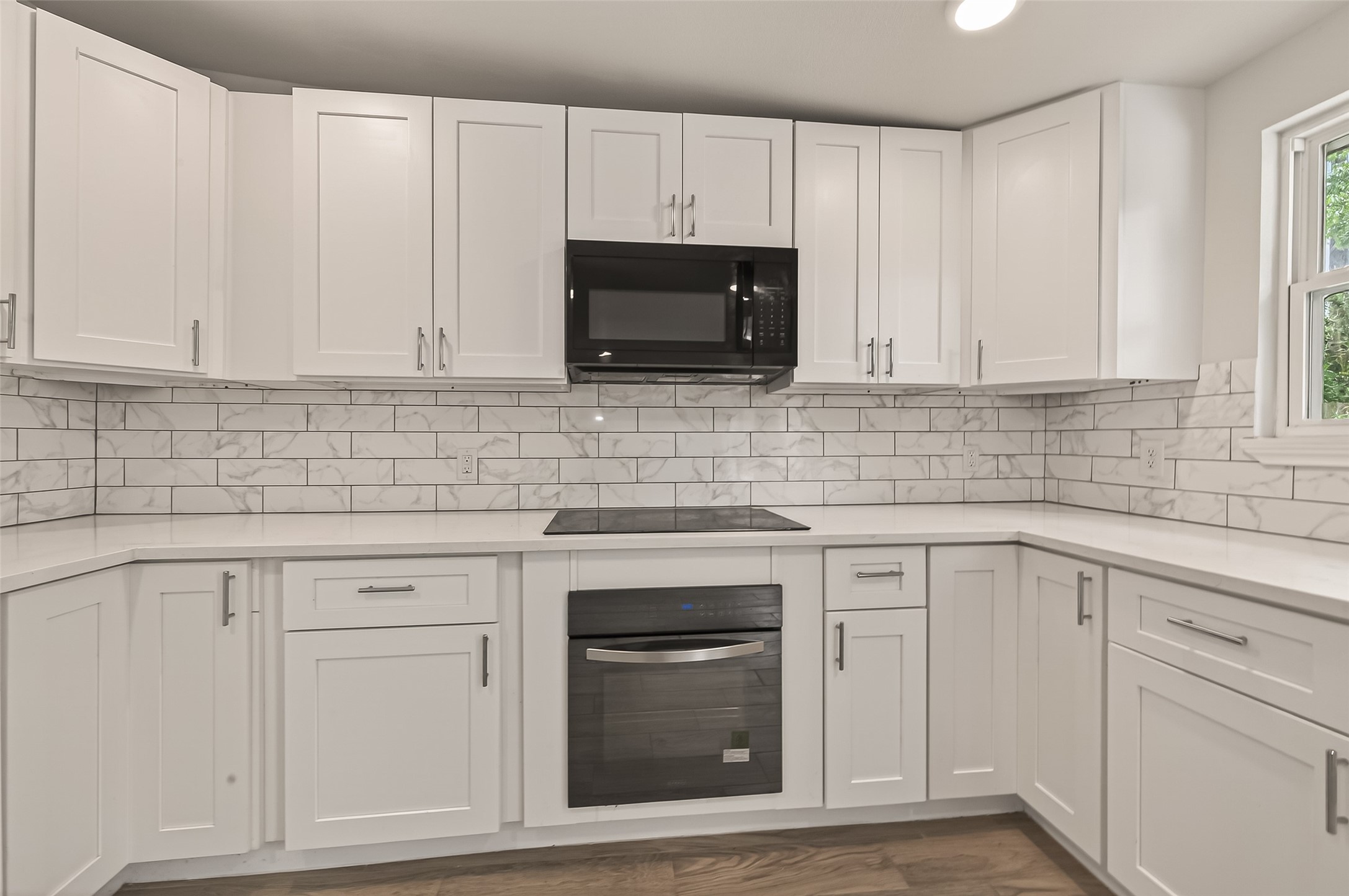 3710 Daphne Street Houston, TX 77021 - Photo 13 of 39 a kitchen with white cabinets and stainless steel appliances