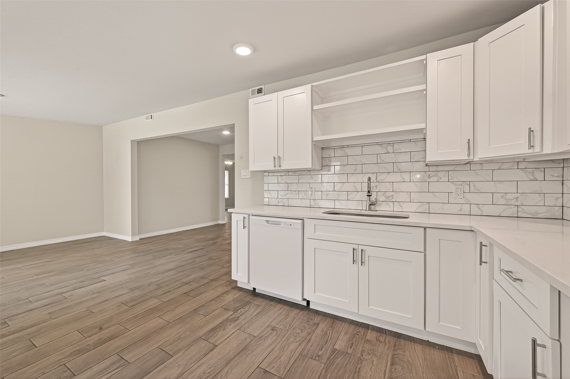 3710 Daphne Street Houston, TX 77021 - Photo 14 of 39 a kitchen with granite countertop white cabinets and a sink