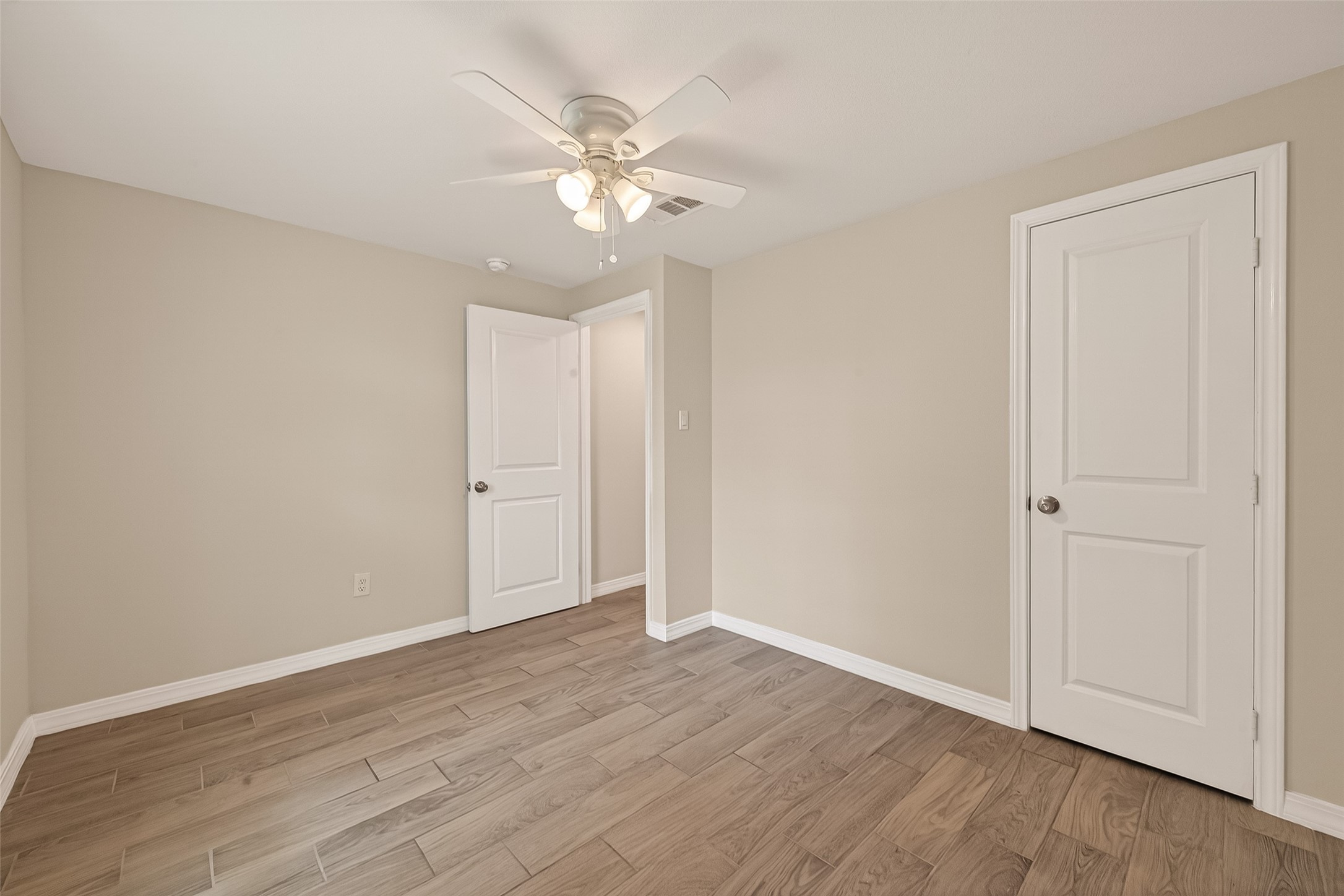 3710 Daphne Street Houston, TX 77021 - Photo 22 of 39 a view of an empty room with wooden floor