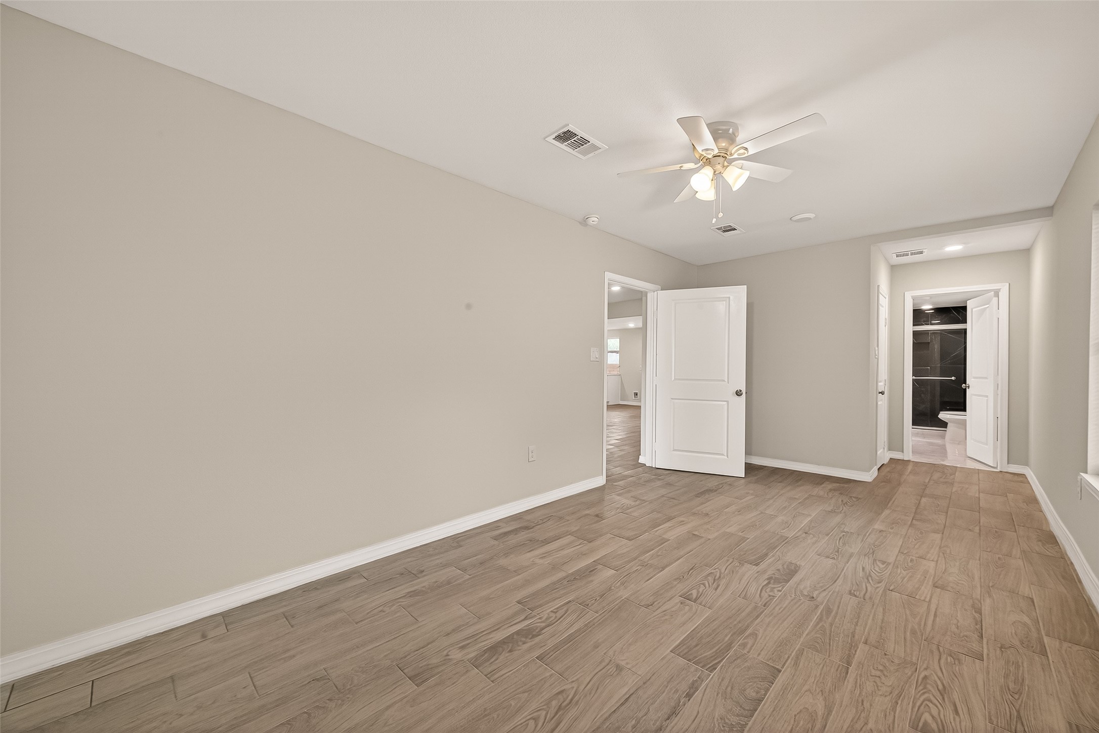 3710 Daphne Street Houston, TX 77021 - Photo 27 of 39 a view of an empty room with wooden floor