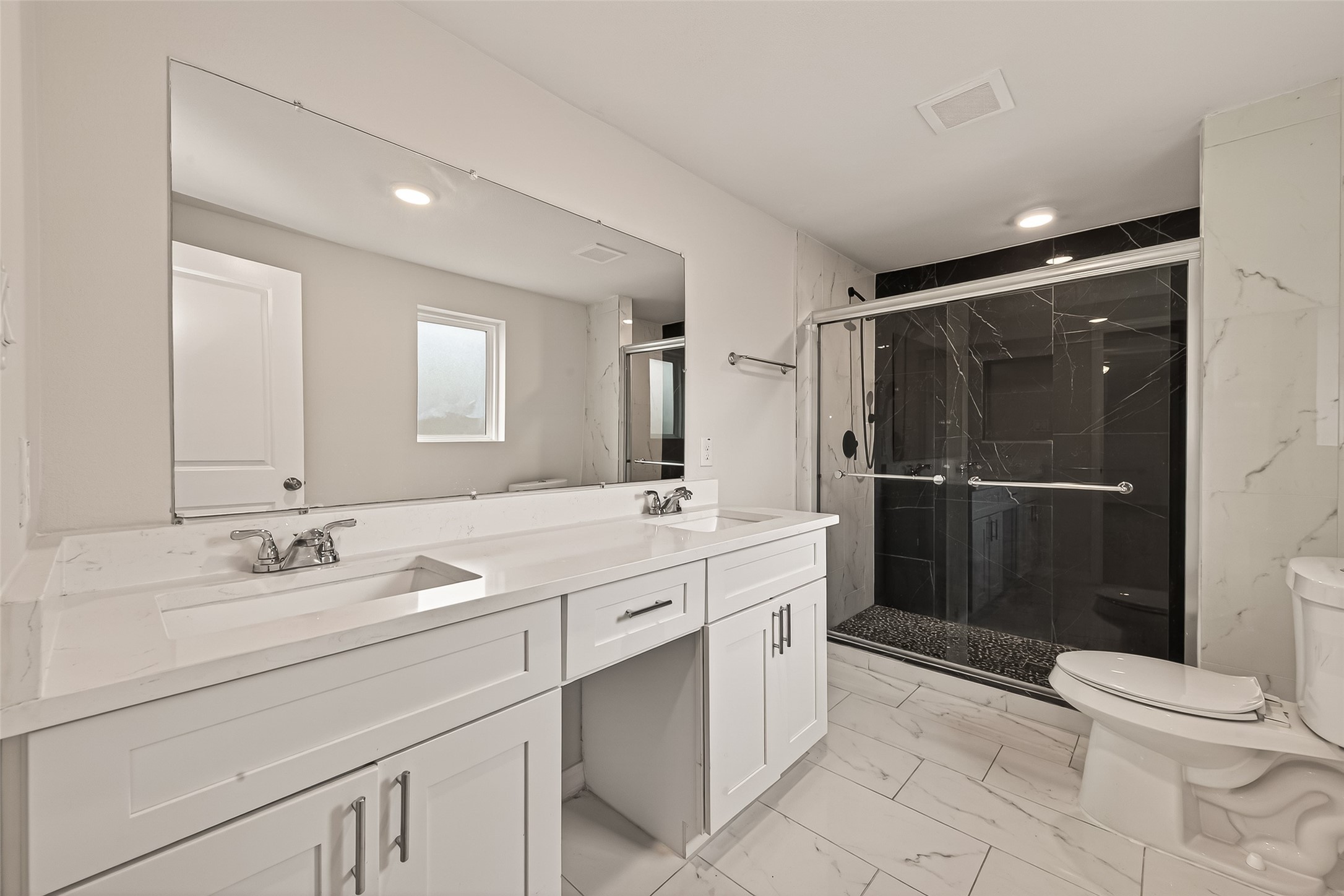 3710 Daphne Street Houston, TX 77021 - Photo 29 of 39 a bathroom with a double vanity sink toilet and shower