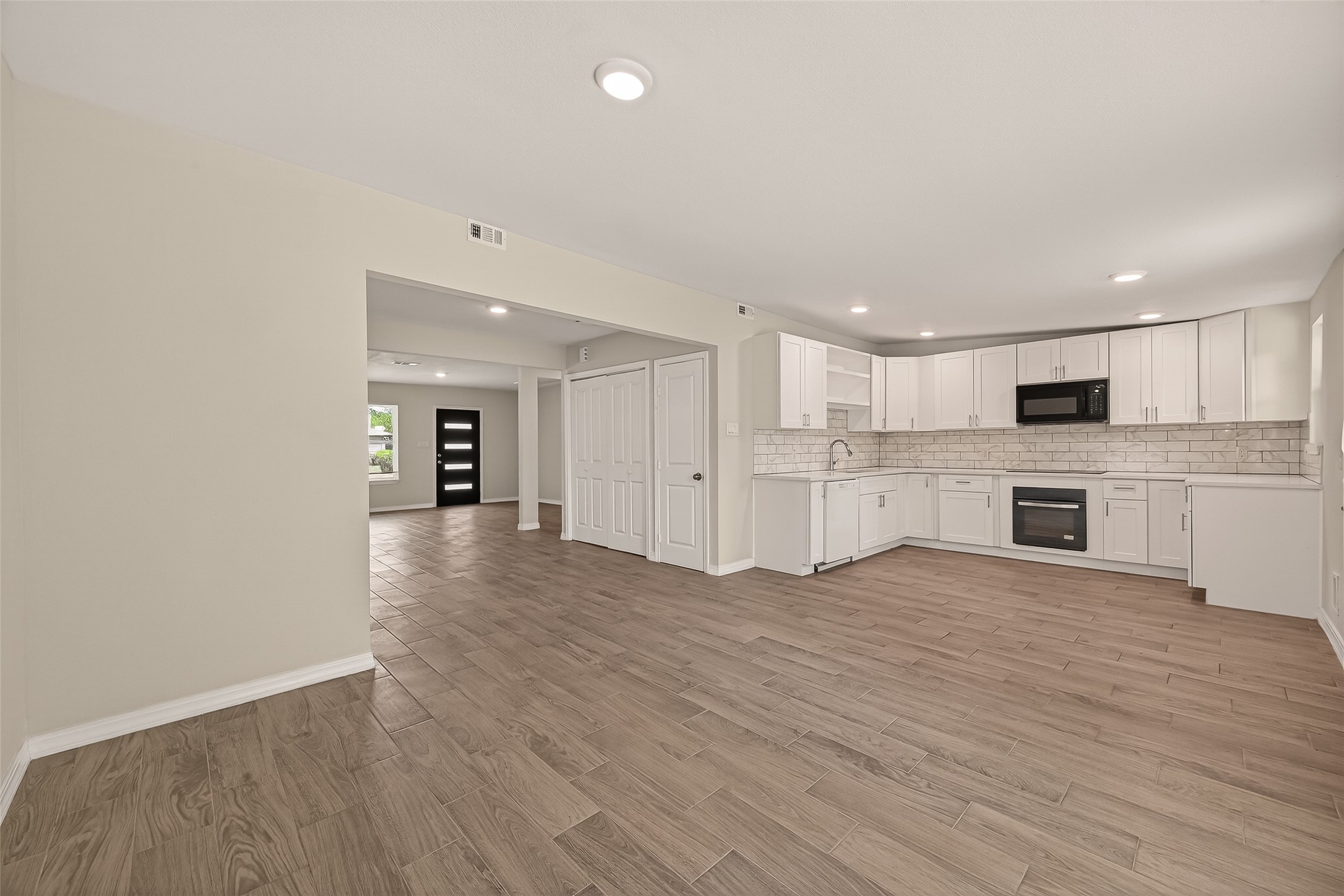 3710 Daphne Street Houston, TX 77021 - Photo 9 of 39 a view of an empty room with kitchen and window