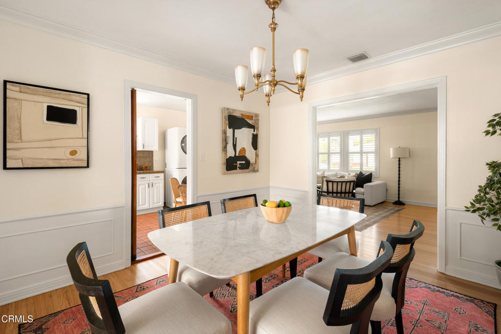 1587 North Harding Avenue Pasadena, CA 91104 - Photo 11 of 37 a view of a dining room with furniture and a chandelier