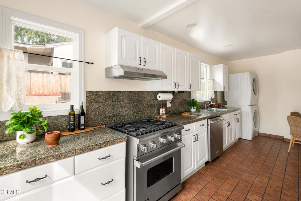 1587 North Harding Avenue Pasadena, CA 91104 - Photo 16 of 37 a kitchen with stainless steel appliances granite countertop a stove a sink and a granite counter tops