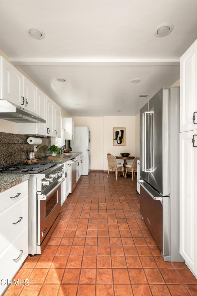 1587 North Harding Avenue Pasadena, CA 91104 - Photo 17 of 37 a kitchen with a sink cabinets and stainless steel appliances