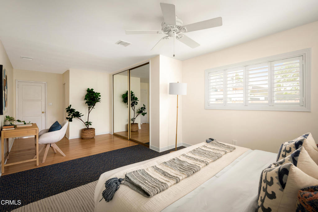 1587 North Harding Avenue Pasadena, CA 91104 - Photo 25 of 37 a bedroom with a bed and wooden floor