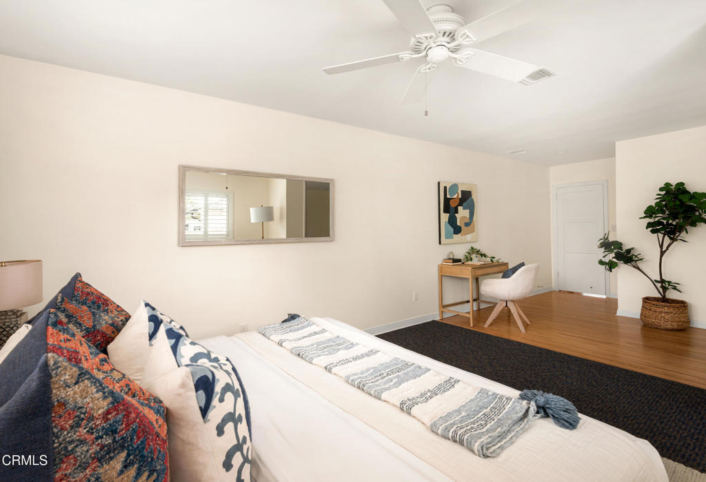 1587 North Harding Avenue Pasadena, CA 91104 - Photo 26 of 37 a bedroom with a bed and a table in it
