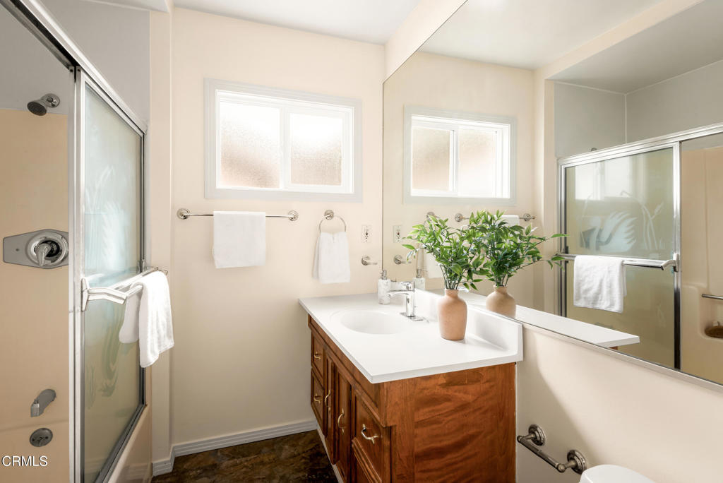 1587 North Harding Avenue Pasadena, CA 91104 - Photo 27 of 37 a bathroom with a sink a mirror and potted plant