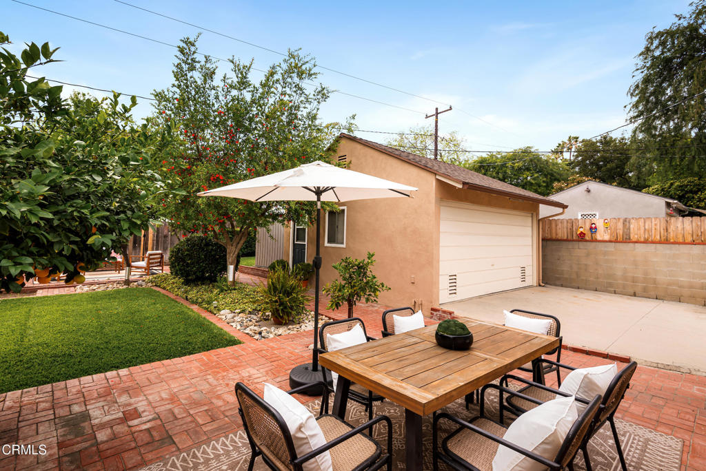 1587 North Harding Avenue Pasadena, CA 91104 - Photo 32 of 37 a backyard of a house with table and chairs