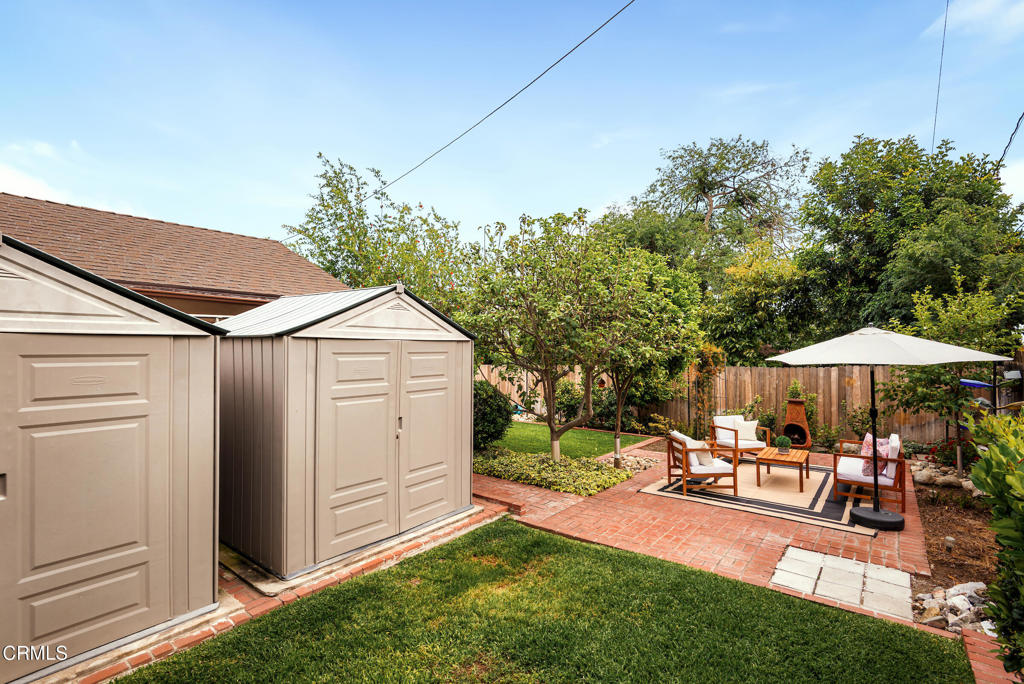 1587 North Harding Avenue Pasadena, CA 91104 - Photo 36 of 37 a view of a yard with wooden fence and a bench