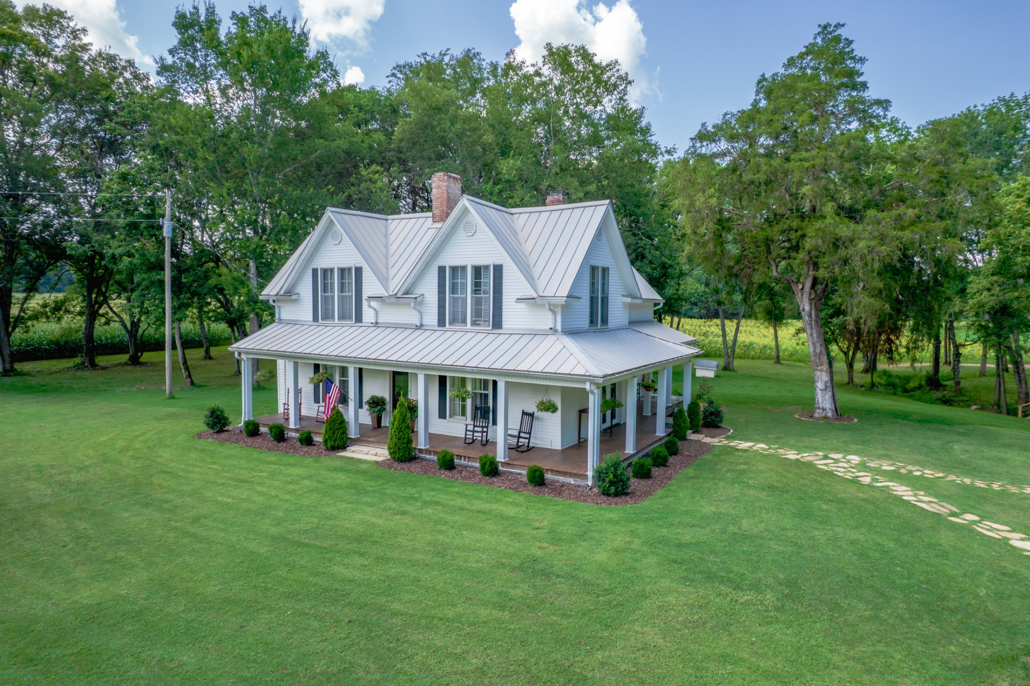 5829 County Road 6 Florence, AL 35633 - Photo 1 of 32 a view of a house with a big yard and large trees