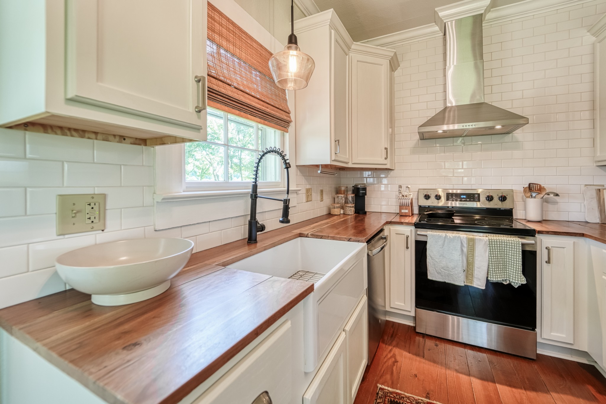 5829 County Road 6 Florence, AL 35633 - Photo 11 of 32 a kitchen with a sink and a stove top oven