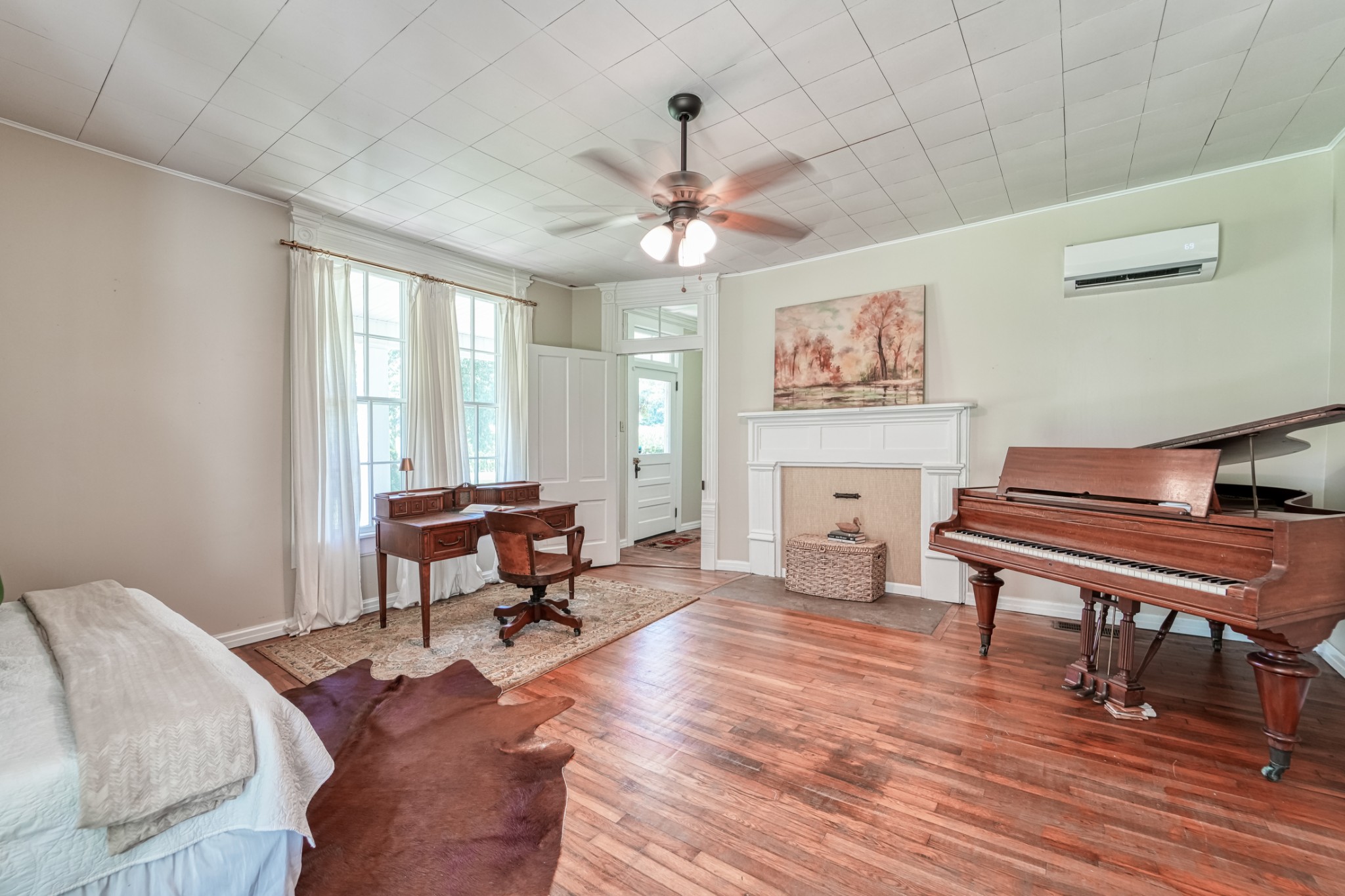 5829 County Road 6 Florence, AL 35633 - Photo 14 of 32 a living room with furniture a piano and a window