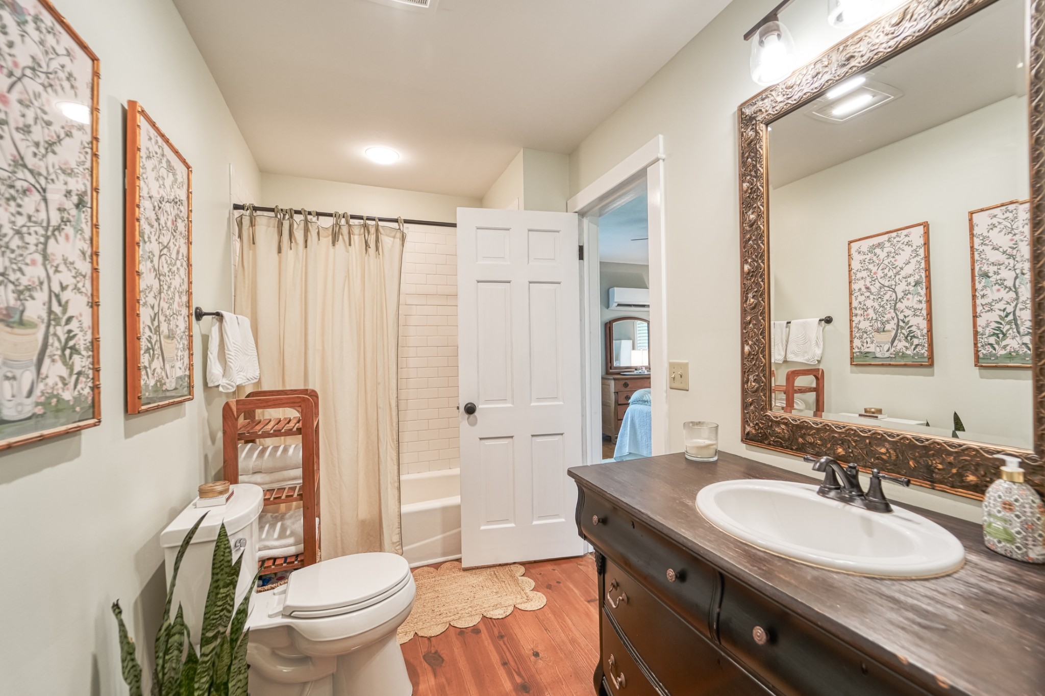 5829 County Road 6 Florence, AL 35633 - Photo 17 of 32 a bathroom with a granite countertop sink toilet a mirror a vanity and shower