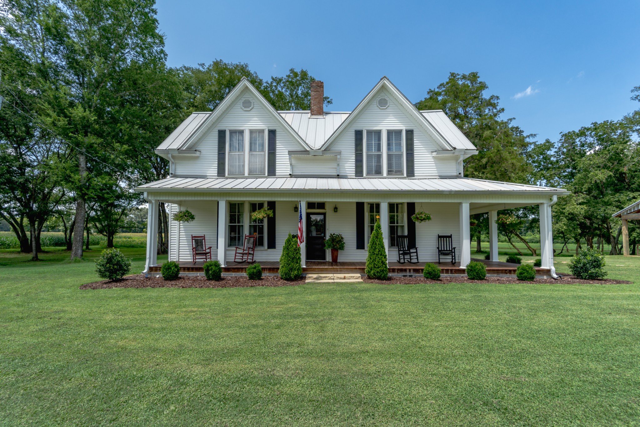 5829 County Road 6 Florence, AL 35633 - Photo 2 of 32 a front view of a house with sitting area and garden
