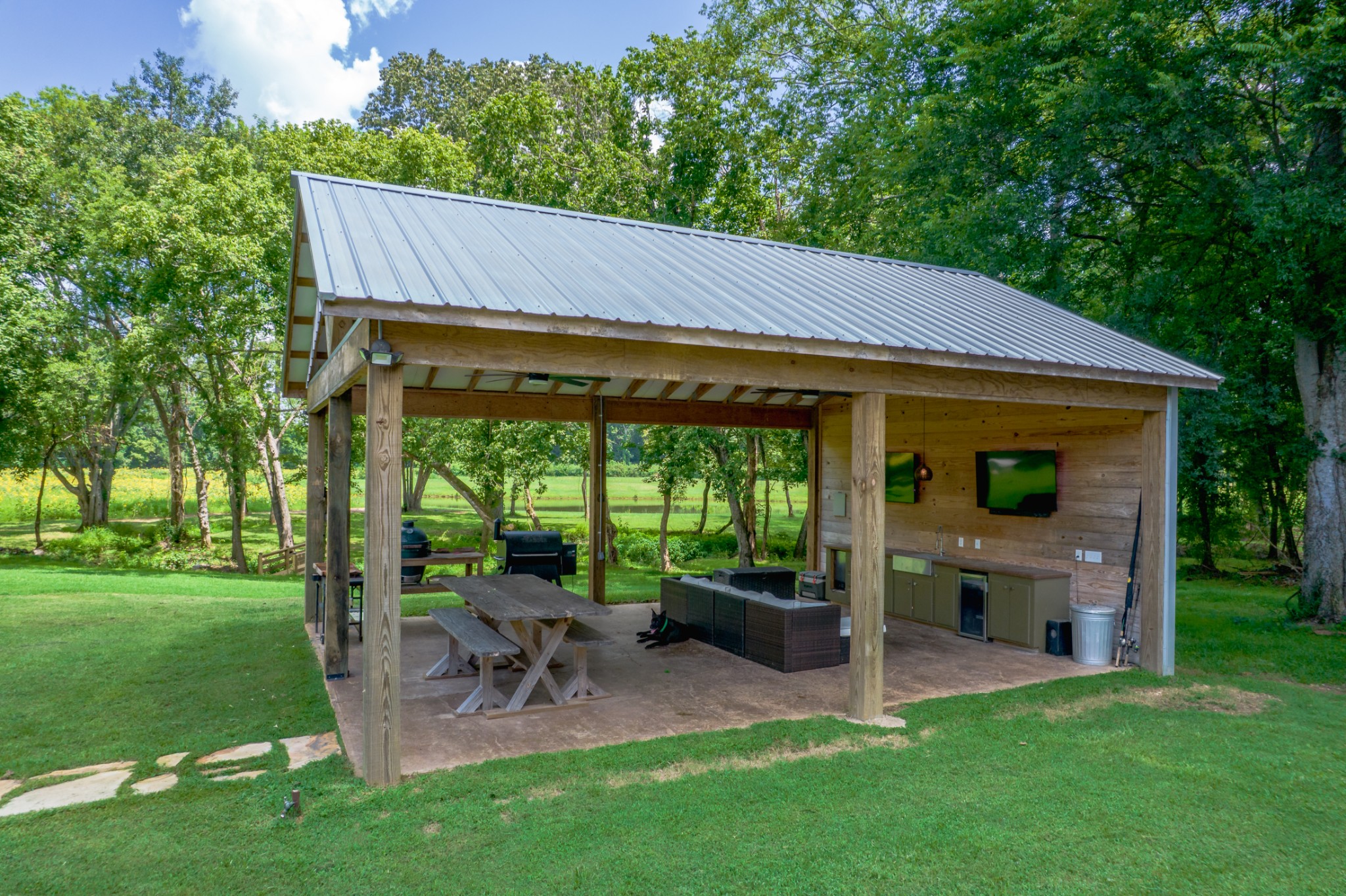5829 County Road 6 Florence, AL 35633 - Photo 29 of 32 a view of a patio with a table chairs and a backyard