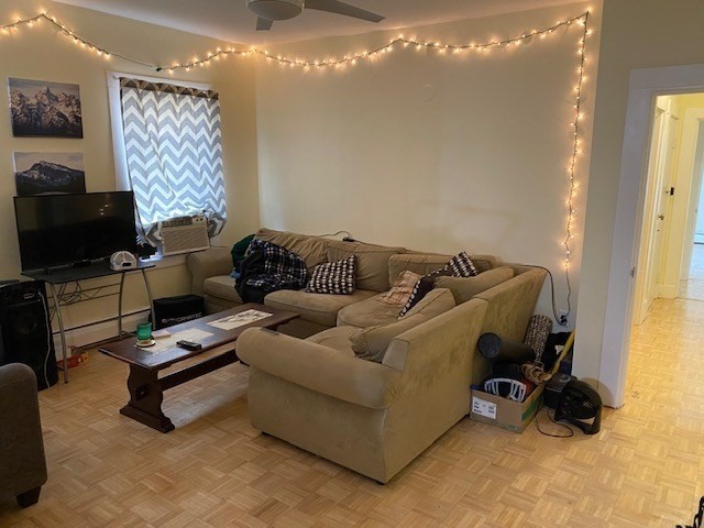 231 High Street, Unit 2 Brookline, MA 02445 - Photo 4 of 12 a living room with furniture and a flat screen tv