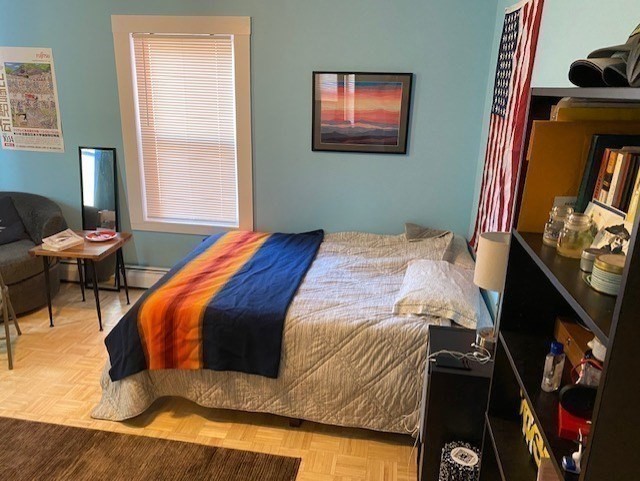 231 High Street, Unit 2 Brookline, MA 02445 - Photo 10 of 12 a bedroom with a bed and dresser