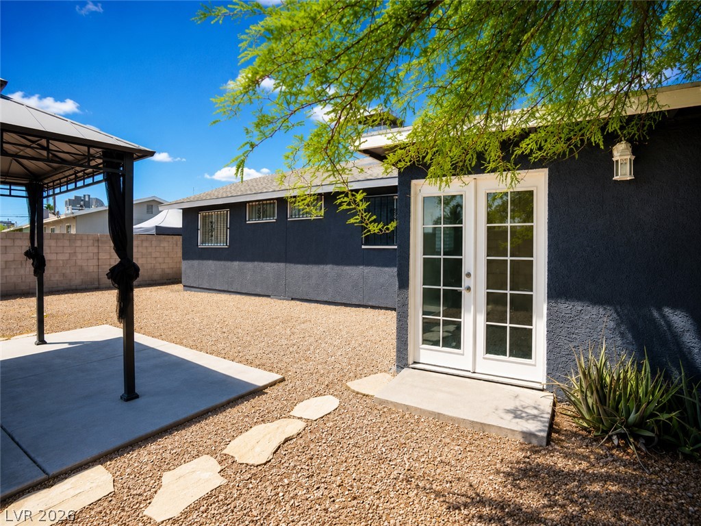 2870 South Sandhill Road Las Vegas, NV 89121 - Photo 15 of 64 A spacious backyard retreat offers a shaded gazebo and easy access to the home.