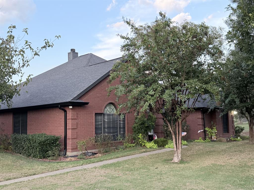 313 An County Road, Unit 2145 Palestine, TX 75801 - Photo 2 of 40 Red brick exterior with a gray shingle roof
