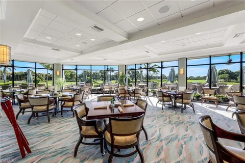 an aerial view of a house a table and chairs