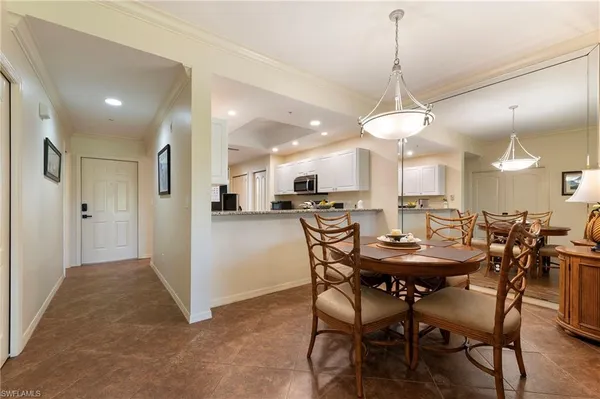 a view of a dining room with furniture window and outside view