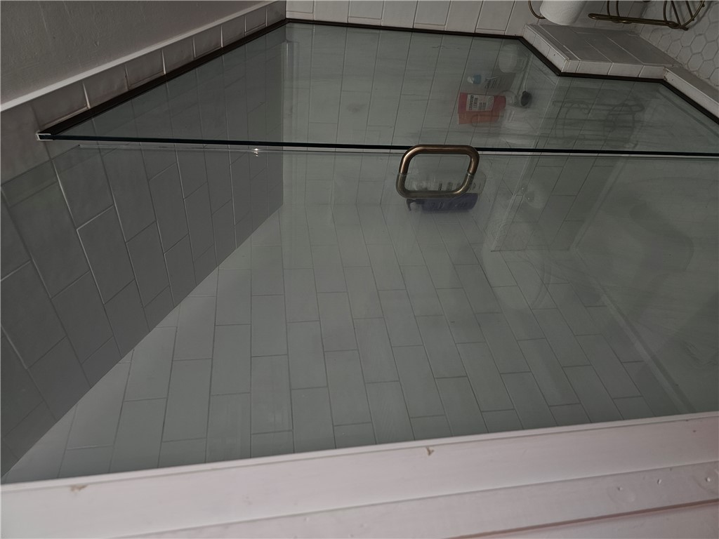 2105 Shroyer Road Dayton, OH 45419 - Photo 25 of 35 Step into this contemporary walk-in shower featuring sleek glass enclosure and durable tile flooring.