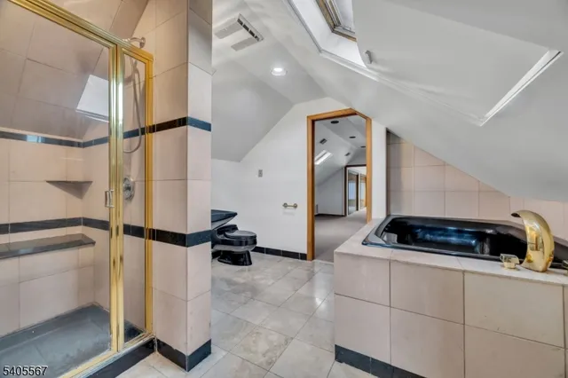 a kitchen with stainless steel appliances a refrigerator and cabinets