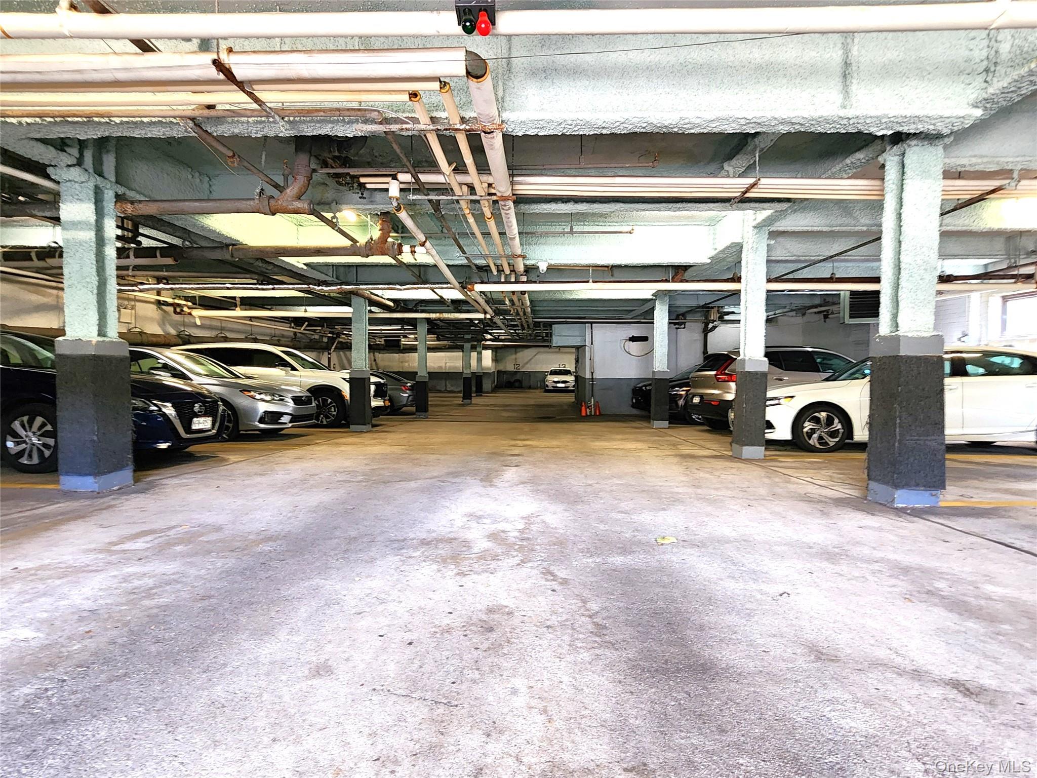 25 Park Place, Unit 3R Great Neck, NY 11021 - Photo 17 of 18 a view of parking garage with cars