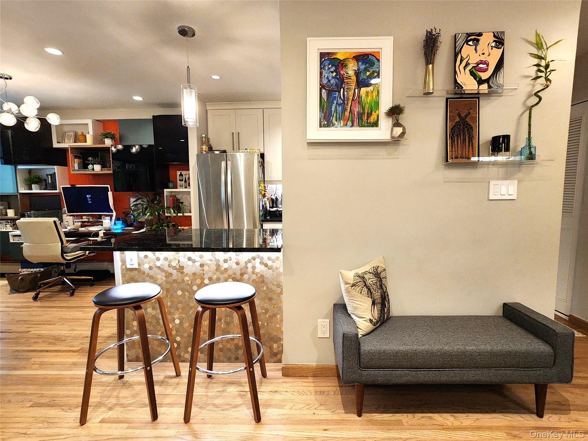 25 Park Place, Unit 3R Great Neck, NY 11021 - Photo 6 of 18 a living room with furniture and kitchen view