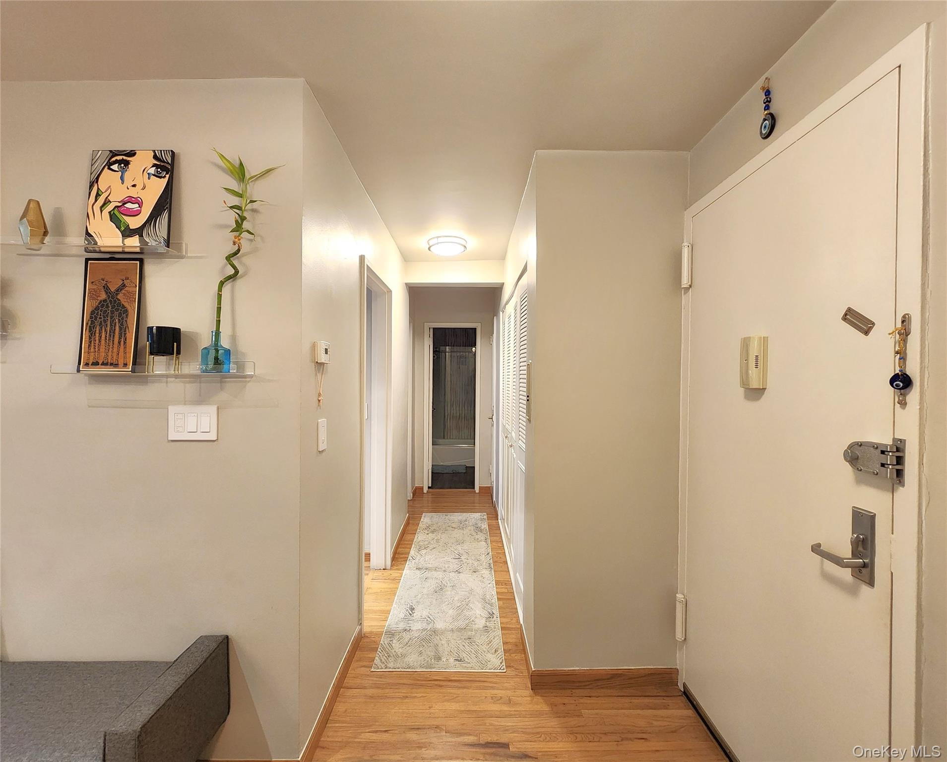 25 Park Place, Unit 3R Great Neck, NY 11021 - Photo 9 of 18 a view of a hallway with elevator