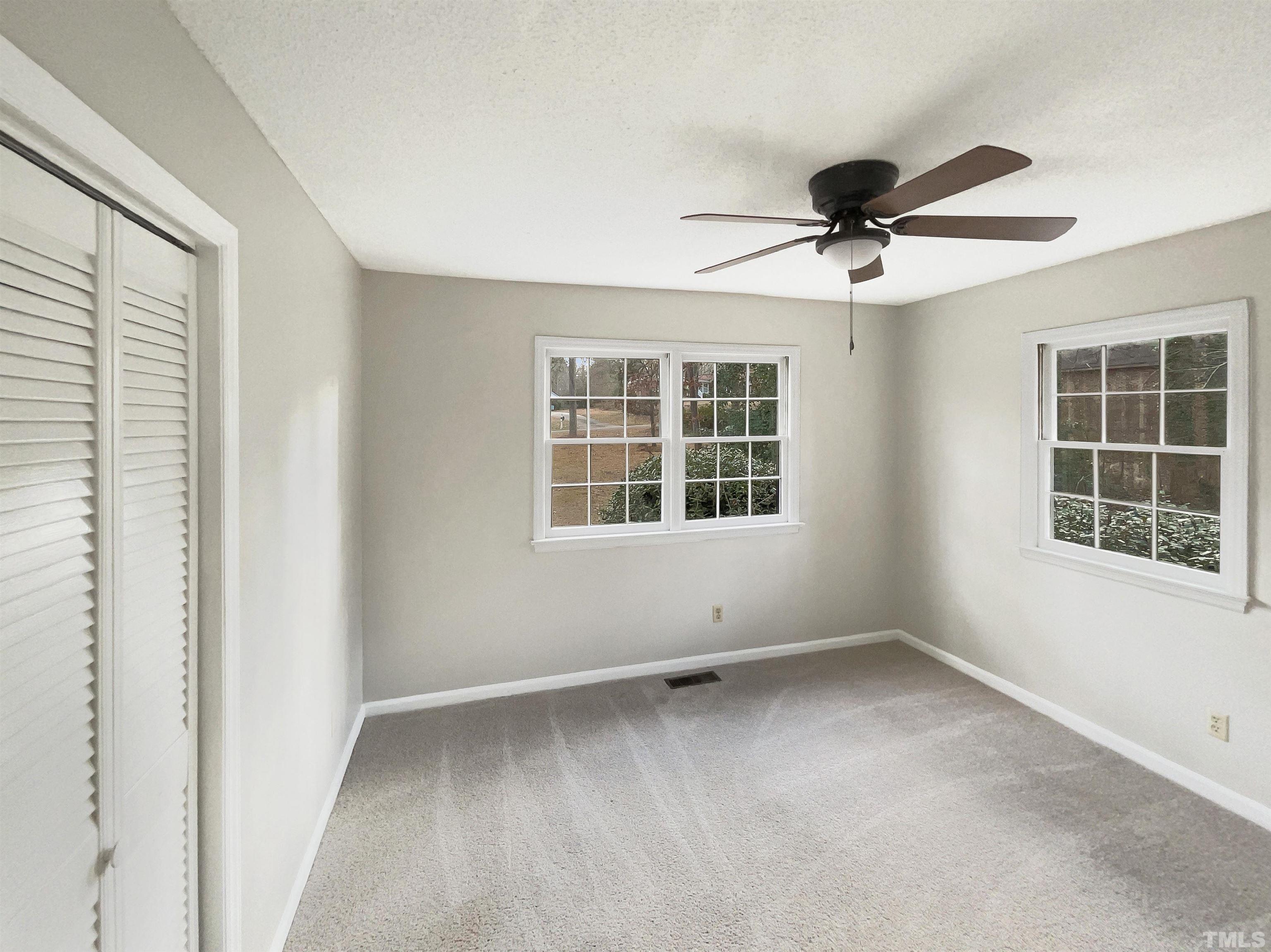 3216 Manor Ridge Drive Raleigh, NC 27603 - Photo 9 of 22 a view of empty room with windows