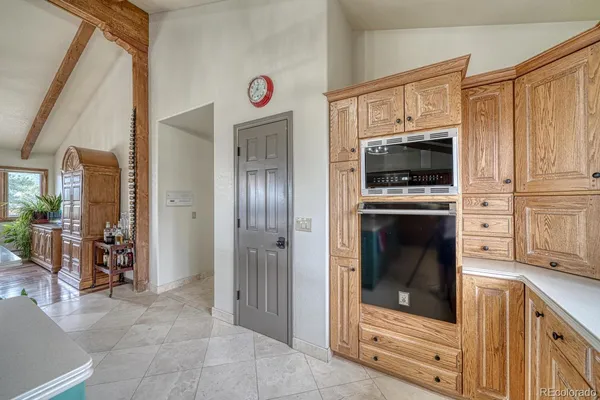 a view of a kitchen with an oven and refrigerator