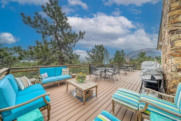 an outdoor living room with furniture