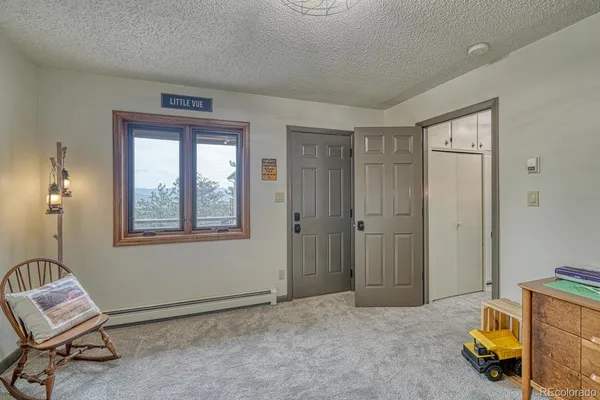 a view of room with workspace and windows