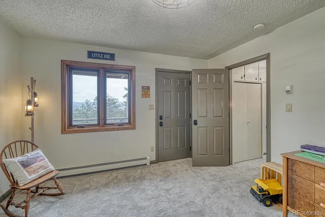 a view of room with workspace and windows