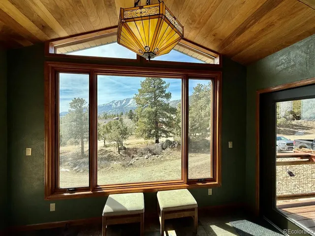 a bedroom with furniture and windows