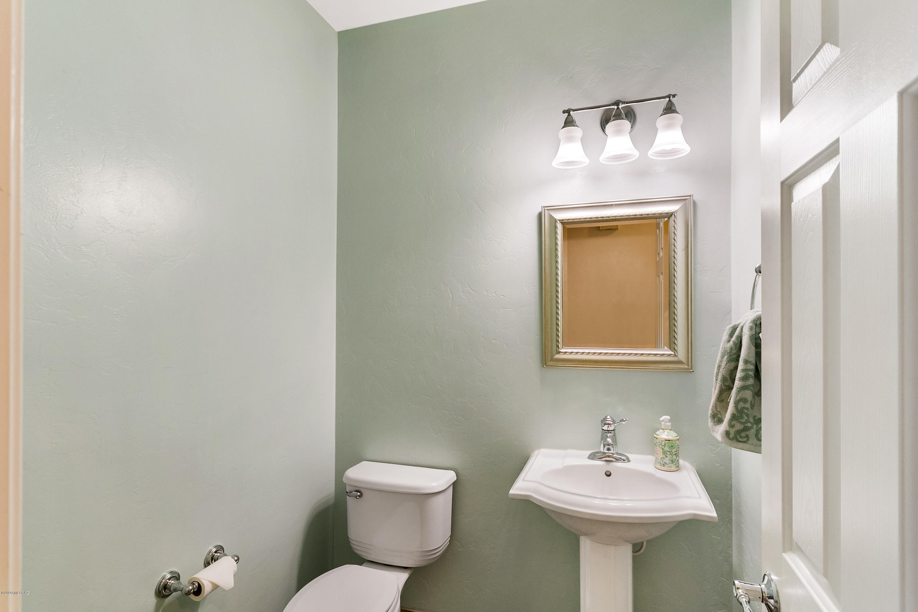 21027 East Treasure Road Red Rock, AZ 85145 - Photo 11 of 29 a bathroom with a sink and mirror with toilet