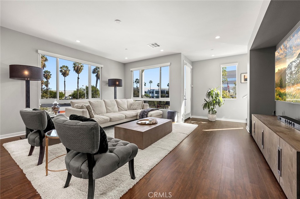 147 Schick Irvine, CA 92614 - Photo 11 of 35 a living room with furniture large window and wooden floor